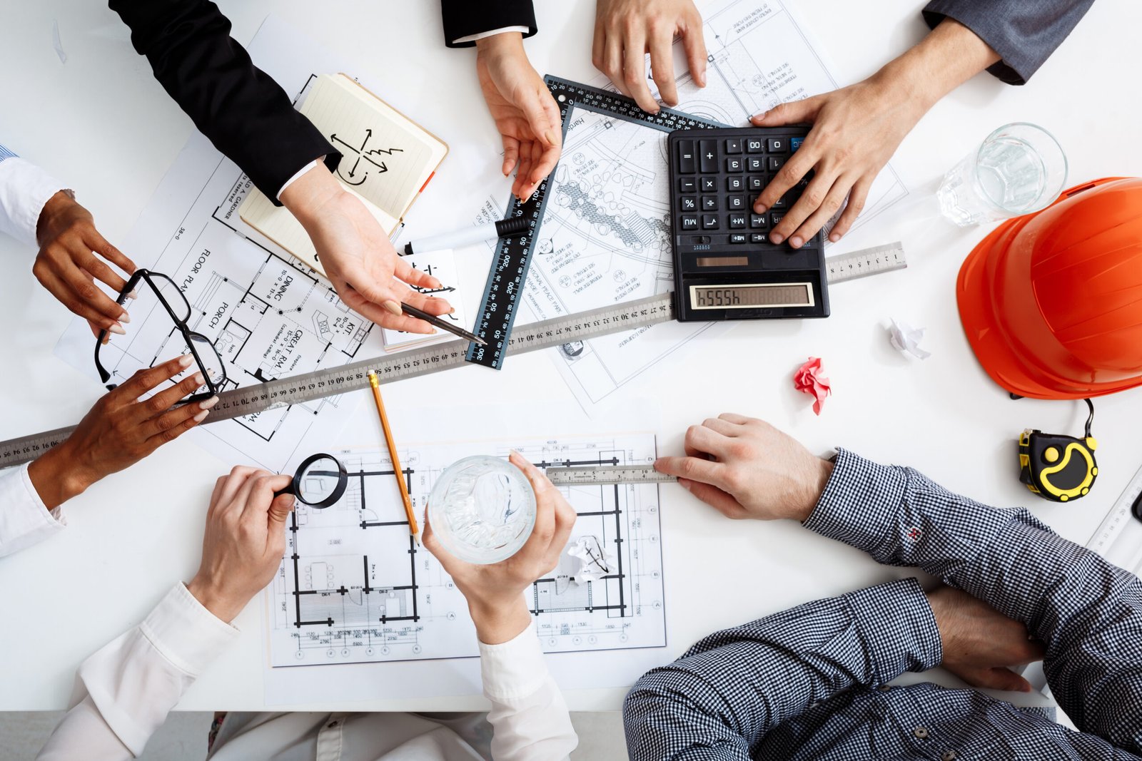 Business owner reviewing industrial lease agreement and budget calculations
